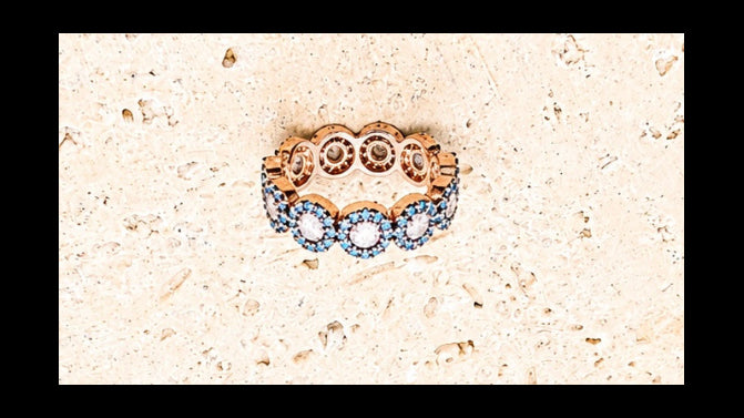 925 Sterling Silver ring with rose gold plating. Turquoise stones with centre crystal stones.