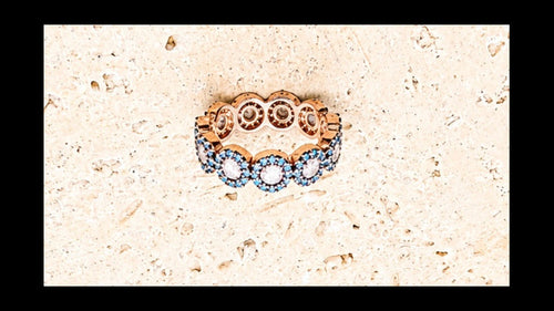 925 Sterling Silver ring with rose gold plating. Turquoise stones with centre crystal stones.