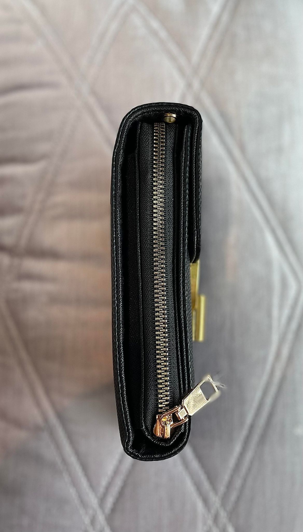 Crossbody bag with bronzed metal clasp