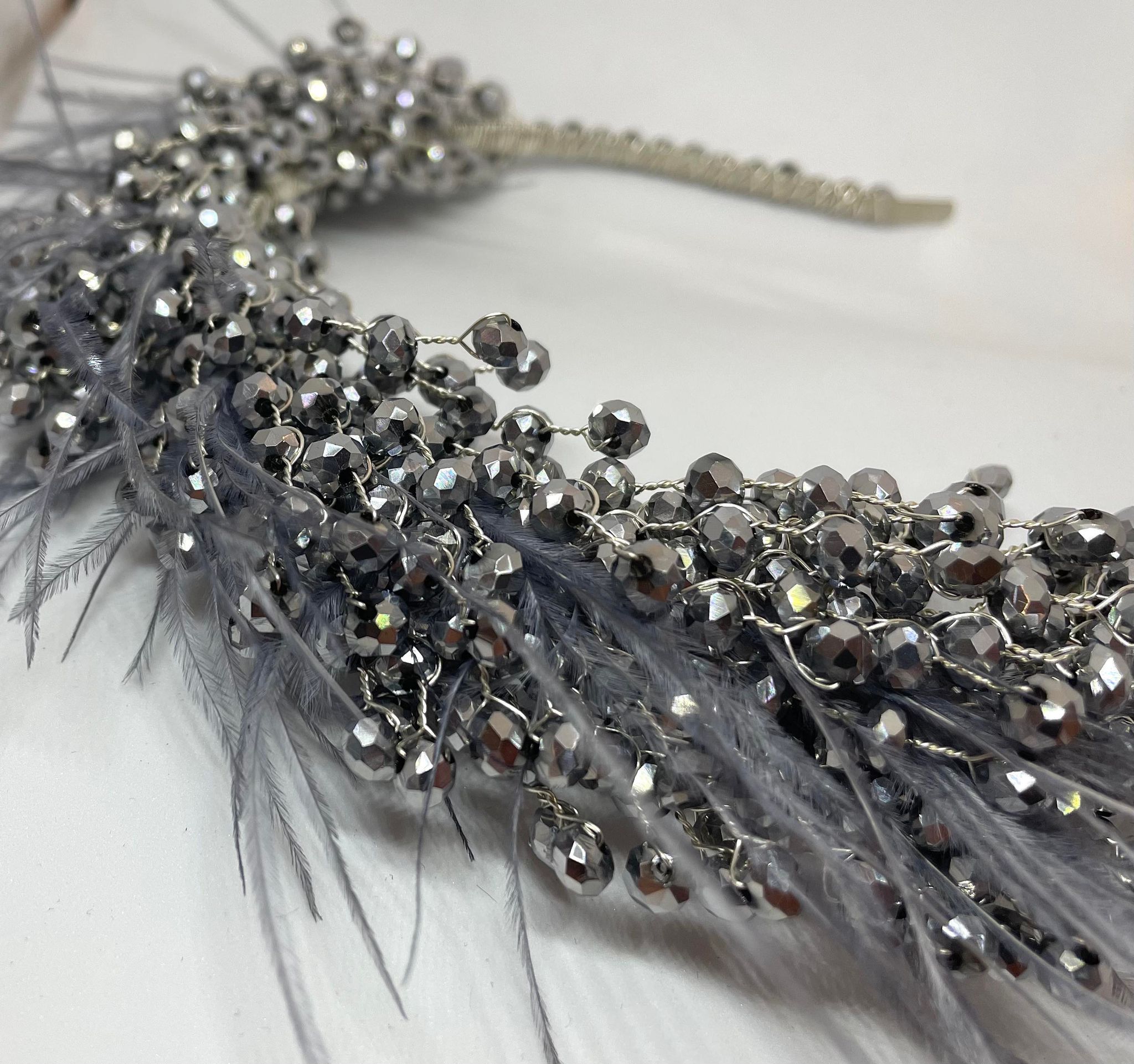 Artisan hair accessory: Headband detailed with feathers and beads- silver