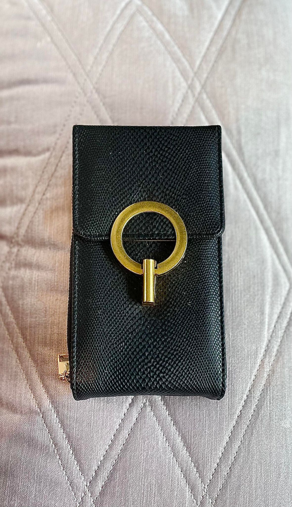 Crossbody bag with bronzed metal clasp