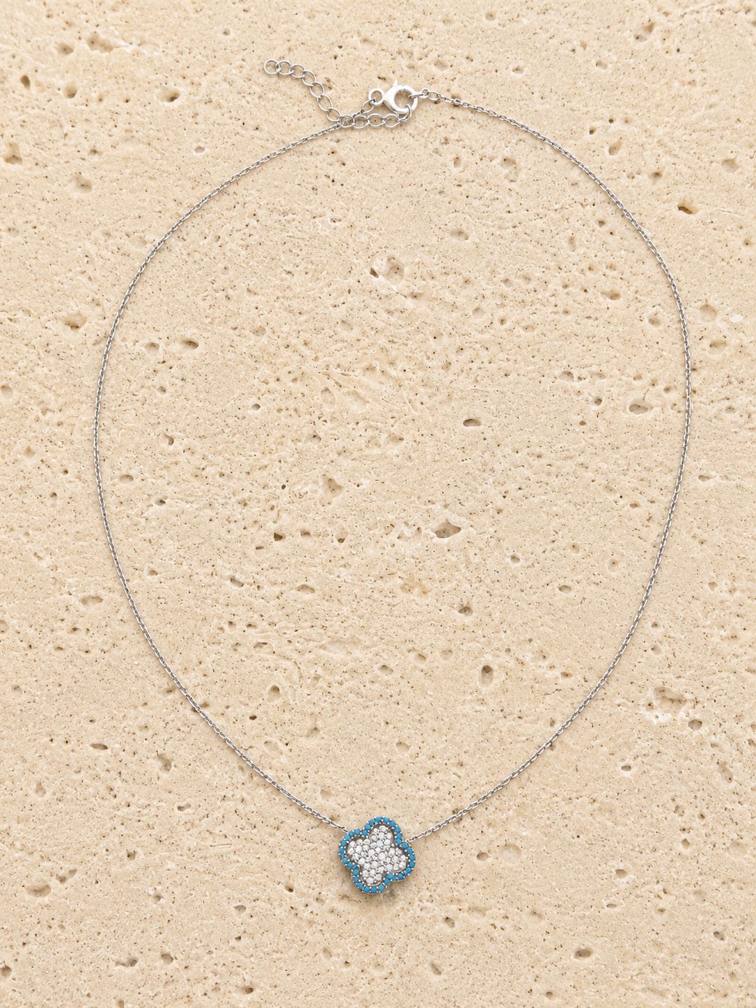 Turquoise and crystal four leaf clover
