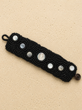 Crocheted beaded cuff with mother of pearl