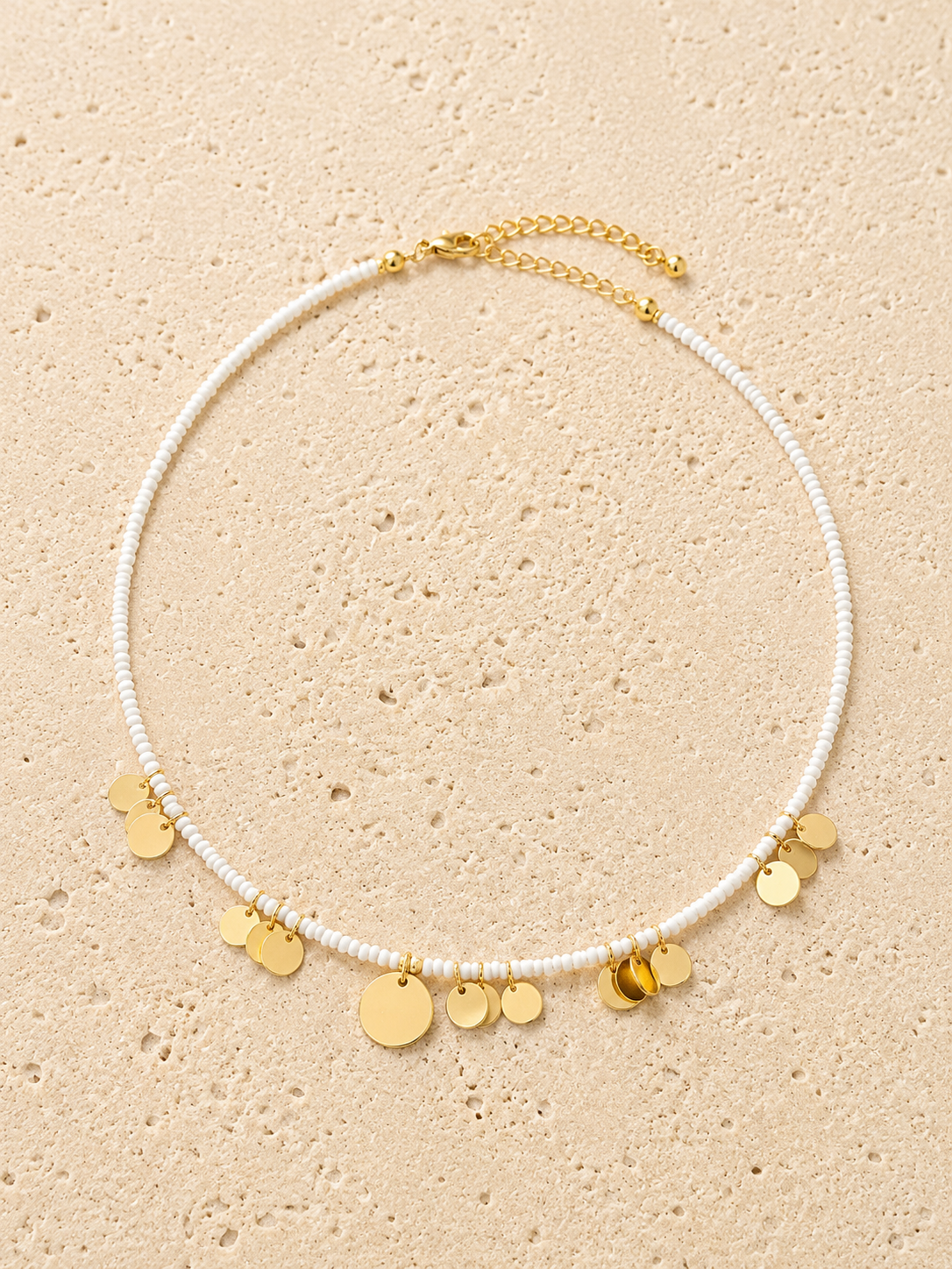 Gold disc and beaded necklace